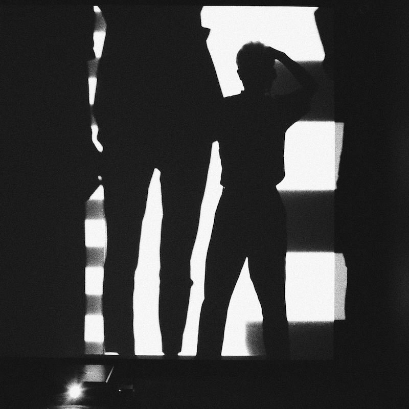 A decorative image of two shadowed silhouettes.